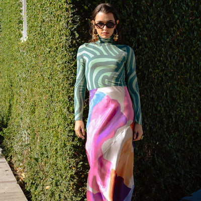 Model posed in Lelaki Skirt from Untitled In Motion and Crysta Turtle Neck from Corey Lynn Calter.
