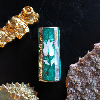 Emerald Flower Vintage Lighter Cover from the Saint Claude Social Club in the home goods section.